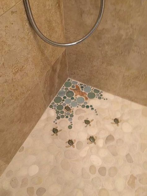 Loving the cute little rock turtles built into the tile!! too cut. i prefer octopus or jelly fish Tile Murals Outdoor, Colorful Shower Floor Tile, Mermaid Floor Tile, Bathroom Ideas Whimsical, Bathroom Tile Ideas Coastal, Bathroom Ideas Small Gold, Beach Shower Tile, Mermaid Bathroom Tile, Tiled Shower Stall Ideas