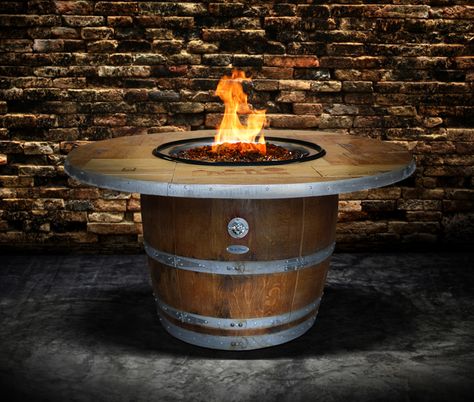 Travel the world of wine while relaxing at home with BOXHILL's Enthusiast Wine Barrel Fire Pit Table. Whether you prefer an oaky California Chardonnay, or a fruitier, Italian Sangiovese, wine lovers alike will be delighted that they now have the perfect place to sit and sip. See all of our beautiful outdoor products at www.shopboxhill.com Wine Barrel Fire Pit, Barrel Fire Pit, Wine Barrel Ideas, Barrel Projects, Barrel Ideas, Wine Barrel Furniture, Fire Pit Ring, Barrel Table, Fire Pit Furniture