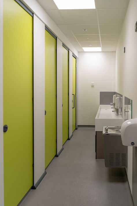 Ultimate privacy was imperative when specifying the primary school toilets for the unisex washroom areas. Julian chose Bushboard’s HiZone toilet cubicles in Zest green and Arctic White. HiZone is a full height toilet cubicle with partitions sitting in durable aluminium skirting at floor level, the ideal choice for full privacy within a unisex washroom area. Julian explained ‘careful planning and good facilities discourage chances of bullying’. School Toilet Design, School Bathroom Design, Toilet Cubicle Design, Hospital Toilet, School Washroom, Bathroom Concrete Floor, School Toilet, School Restroom, Bathroom School