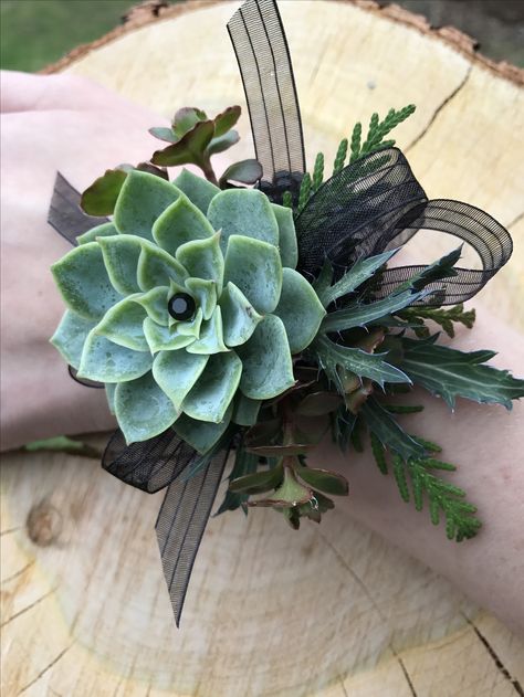 Succulent corsage designed by Simply Exquisite by the Bay Succulent Corsage Prom, Corsages For Dark Green Dress, Grad Corsage Ideas, Clutch Bouquet For Prom, Green Corsage, Prom Corsage Ideas, Succulent Corsage, Red Corsages, Prom Flowers Corsage