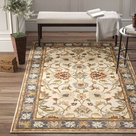 Welcome classic character and floral flair into any arrangement with this dynamic area rug, showcasing a traditional Persian-inspired pattern with botanical accents. This piece has a low 0.393" pile height that helps it handle heavy foot traffic, making this design an ideal base for any busy indoor space. Wherever you decide to roll out this rug, we recommend you pair it with a pad so it stays put. Tan Area Rug, Warm Color Schemes, Tan Rug, Hooked Wool, Yellow Area Rugs, Green Area Rugs, Beige Background, Brown Area Rugs, Birch Lane