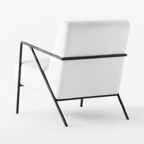 From German designer Jannis Ellenberger comes a lounge chair that blends modern, traditional and playful details. Black hammered steel arms and legs support cushions upholstered in white textured basketweave performance fabric. CB2 exclusive.  -Designed by Jannis Ellenberger -Cotton/poly performance fabric -Solid steel rod arms and legs with matte black hammered finish -Solid and engineered wood frame -Sinuous wire spring suspension -Made in India Imogene White Performance Fabric Lounge Chair Cb2 Camden Chair, Cb2 Chiaro Chair, Cb2 Mink Chair, Cb2 Boucle Chair, Cb2 Gwyneth Boucle Chair, Fabric Lounge Chair, Apartment Sofa, Old Fashioned Glass, Steel Rod