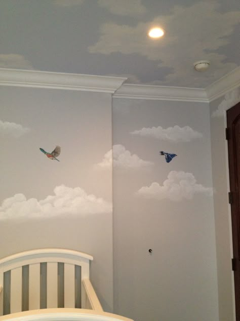 Our finished nursery! This is a shot of our light grey walls and light blue ceiling, all accented by beautiful clouds and birds. Amazing mural work from Katie Gaines @lovepaperpaint !! We are so in love! #genderneutral #tree #bird #mural #baby #clouds Nursery Sky Ceiling, Nursery Cloud Wall, Ceiling Clouds Painting, Blue Ceiling Nursery, Bedroom With Painted Ceiling, Bird Themed Nursery, Light Blue Ceiling, Cloud Ideas, Cloud Project