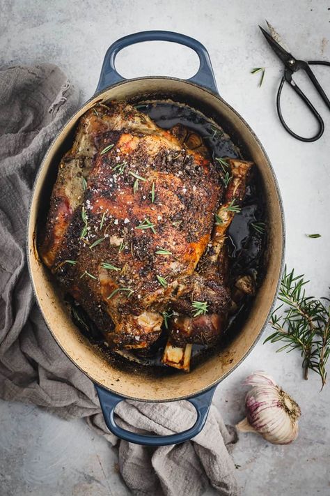 This super easy and delicious Dutch oven leg of lamb recipe is full of fresh garlic and rosemary. A roast night classic dinner! Dutch Oven Leg Of Lamb, Leg Of Lamb Roast Boneless Dutch Oven, Boneless Leg Of Lamb Recipes Dutch Oven, Oven Roasted Leg Of Lamb Bone In, Roasted Lamb Leg Boneless, Irish Lamb Recipes, Dutch Oven Lamb Roast, Boneless Butterflied Leg Of Lamb Recipes, Lamp Leg Recipe