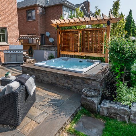 Surrounding your hot tub with a stone wall is a great way to give your backyard a premium look Retaining Wall Hot Tub, Hotub Ideas Patio, Swim Spa Privacy Ideas, Hot Tub With Privacy Wall, Hot Tub Next To House, Hot Tub Privacy Wall, Jaccuzi Outdoor Backyards, Backyard Patio Designs With Hot Tub, Hot Tub Ideas Backyard Privacy