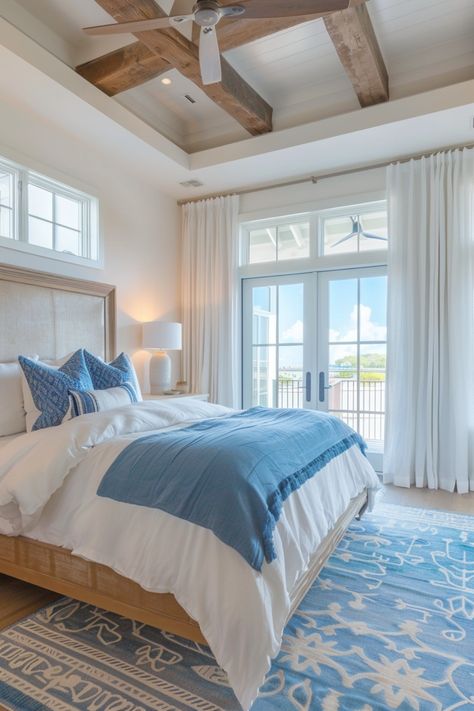 Bright bedroom with a wooden ceiling, large windows, and blue accents. Minimal Beach Bedroom, Beach Wallpaper Bedroom, Nantucket Aesthetic Bedroom, Coastal Lake House Interior Design, Nantucket Style Bedroom, Beach Master Bedrooms Decor, Coastal Grandma Bedroom, Beach Bedroom Ideas Coastal Style, Room Ideas Beach