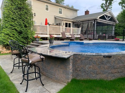 Semi-Inground Pool Builder in Rockland, Westchester & Orange County, NY Semi Inground Pool And Hot Tub, Oval Above Ground Pool With Deck Off House, Semi Inground Pool With Bar, Backyard Semi Inground Pool Designs, Stealth Pool Landscaping, Semi Inground Pool Landscaping Ideas, Semi Inground Pool Deck Ideas, Semi Inground Pool With Deck, Small Semi Inground Pool Ideas