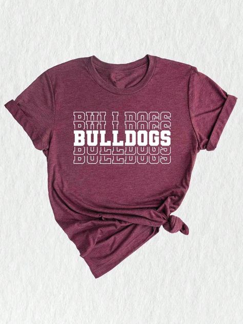 Show your Bulldogs team spirit with this stylish and comfortable Team Mascot Shirt!  Designed specifically for proud Bulldog supporters, this shirt is perfect for alumni, parents, and fans of the Bulldogs! Featuring a bold Bulldog Mascot design, this shirt is sure to make a statement wherever you go. Made with high-quality materials, this Bulldog Mascot Tee is exceptionally soft and comfortable to wear. Whether you're cheering on the Bulldogs from the sidelines or enjoying a casual day out, this shirt is the perfect choice. Its durable construction ensures it will last season after season, letting you show off your Bulldogs pride year-round. The Bulldogs Team Shirt is not just for game day - it's a versatile piece that can be worn in various settings. Pair it with jeans or leggings for a c Bulldog Spirit Shirt Ideas, Bulldog Shirts School Spirit, Team Spirit Shirts, Mascot Shirt, Senior Stuff, Bulldog Mascot, Bulldog Mom, Bulldog Shirt, Team Mascots