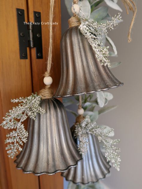 Make this DIY silver bell trio and transform plastic bells from the dollar store into high-end holiday decor Diy Jingle Bell Garland, Rustic Christmas Bells Diy, Vintage Christmas Store Displays, Bundt Pan Christmas Crafts, Silver Bells Christmas Party Theme, Diy Bejeweled Christmas Ornaments, Diy Large Bells, Dollar Store Winter Decor, Rustic Bells Decor Christmas Decorations