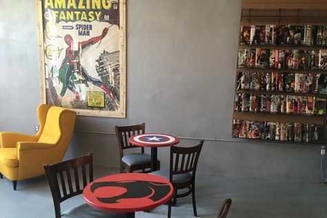 Owner seeks to build inclusive community around superheroes and java - Jerome Maida, Philadelphia Daily News Book Bakery, Amalgam Comics, Marvel Store, Comic Book Shop, Yellow Chair, Interior Design Presentation, Comic Book Store, Comic Store, Comic Shop