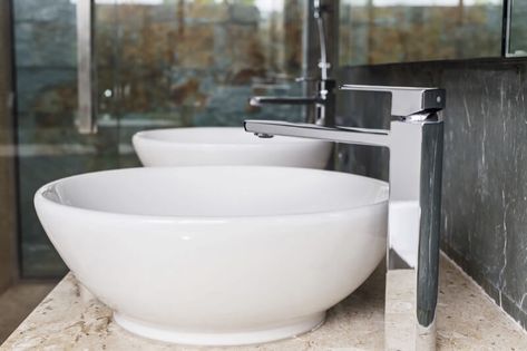 Vessel sinks have become all the rage as of late and are often one of the first design elements that come to mind when considering a contemporary style. However, if you trace the design of a vessel sink through history it's closer to a classic look. It resembles what used to be on every vanity before modern plumbing: the wash basin. But despite their style classification, vessel sinks are one of the fastest ways to add a new look to your bathroom without spending a fortune. Bathroom Bowl Sink Ideas, Powder Room Vanity Ideas, Bathroom Bowl Sinks, Bowl Bathroom Sink, Bowl Sink Bathroom, Bathroom Remodel Small Diy, White Vessel Sink, Vessel Sink Vanity, Powder Room Vanity