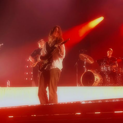 girl in red performing in afas live in amsterdam with red light behind her. she is holding her guitar Girl In Red Singer, Girl In Red Aesthetic, Girl In Red Concert, Marie Ulven, Marriage Material, Girl In Red, Red Tour, Concert Fits, Girly Dresses