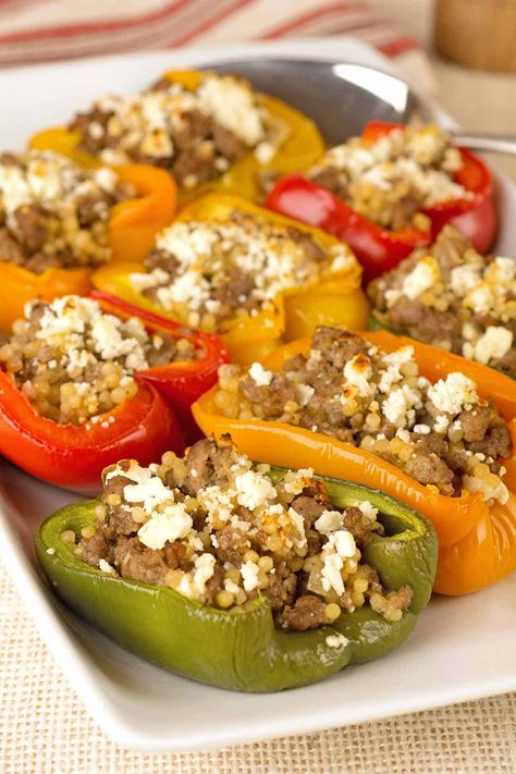 This Mediterranean-inspired stuffed pepper recipe is made with a flavorful blend of ground lamb, pearl couscous, fresh lemon, rosemary and crumbled feta cheese. #maindish #dinner #recipe #lamb Lamb Stuffed Peppers, Mediterranean Lamb, Greek Stuffed Peppers, Stuffed Pepper Recipe, Ground Lamb Recipes, Recipes Mediterranean, Pearl Couscous, Pepper Recipe, Easy Mediterranean Diet Recipes