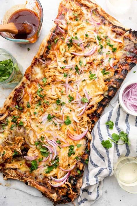 Transform your pizza night with the ultimate Grilled BBQ Chicken Pizza recipe! Featuring BBQ sauce, a blend of two cheeses (hello, mozzarella and gouda), red onion, and cilantro, this 'za is a dream for cheese and savory flavor enthusiasts. Bbq Chicken Pizza Recipe, Chicken Pizza Recipe, Easy Bbq Chicken, Chicken Pizza Recipes, Goat Cheese Pizza, Grilled Bbq Chicken, Easy Homemade Pizza, Bbq Chicken Pizza, Easy Bbq