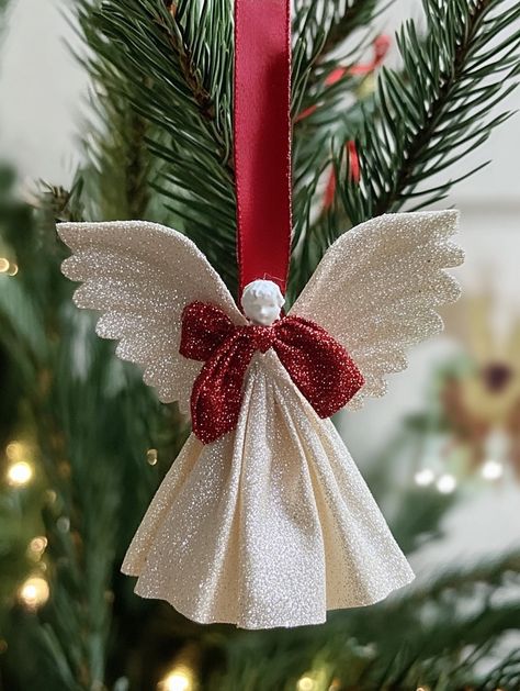 Curious about how to craft the perfect holiday ornament? Discover unique handmade angel designs that will elevate your Christmas decor. From wooden peg angels to elegant macrame creations, this post gives you step-by-step instructions for creating beautiful ornaments that will leave everyone in awe! Diy Cloth Angel Ornaments, Diy Tulle Angel Ornaments, Mesh Angels How To Make A, Angel Tree Ideas Charity, Fabric Angel Ornaments Diy, Ribbon Angels How To Make, Diy Angels Crafts How To Make, Angel Diy Crafts, Diy Christmas Angel Tree Topper