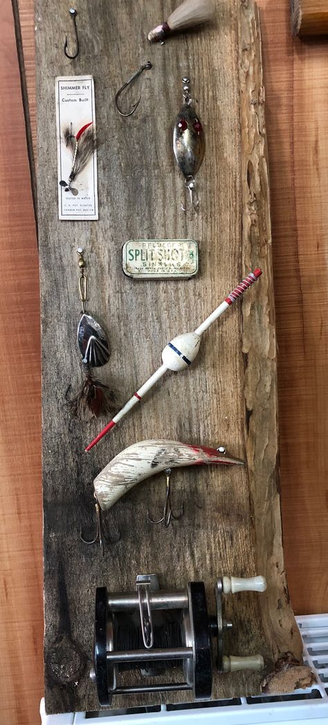 Vintage fishing lure display Lure Display Ideas, Vintage Fishing Lures Display, Old Fishing Lures Crafts, Fishing Lure Display Ideas, Fishing Lure Display, Fishing Cabin Decorating Ideas, Fishing Reel Display, Old Fishing Lures Display Ideas, Fishing Lure Decor