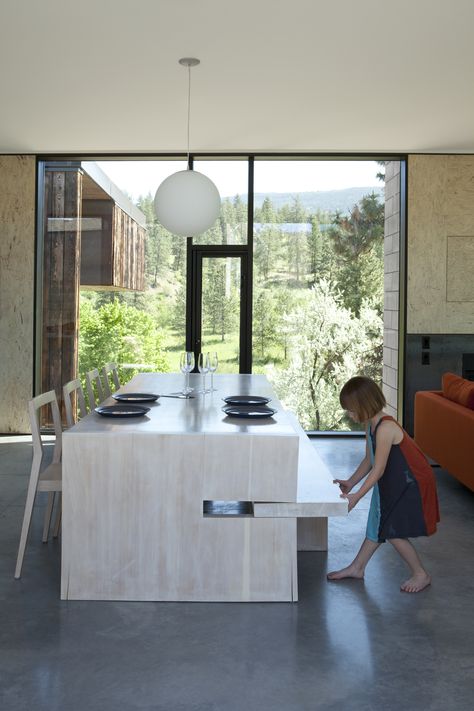 A custom table designed by Jones features a pull-out bench on one side and 1C dining chairs by Room B on the other; the Globo pendant is by Viso. Small Dining Room Table, Steel Sheets, Structural Insulated Panels, Kitchen Island Table, Small Room Design, Concrete Blocks, Functional Furniture, Grow Out, Custom Table