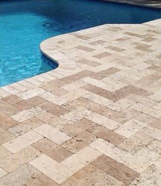 Medium river tumbled 6x12 herringbone travertine paver pool deck in Seminole, Florida #travertine #tumbled #herringbone #paver #pool #ceramictec Paver Pool Deck, Pool Deck Tile, Travertine Pool Decking, Travertine Patio, Wesley Chapel Florida, Beach Projects, Natural Stone Paving, Deck Inspiration, Pool Paving