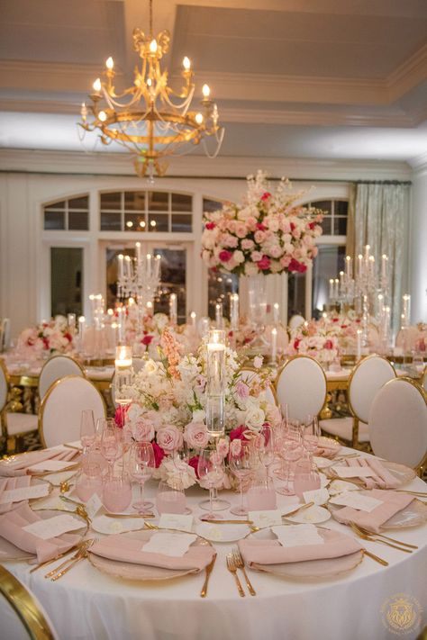 Kristi & Alex’s stunning country club wedding featured pink and white wedding decor. The outdoor ceremony included large pink and white floral arches draping over a mirrored aisle. The wedding reception featured gold and crystal decor with pink & white centerpieces, candelabras and pink glassware. | Floral, Decor, Production, Rentals: Royal Luxury Events / Photo: Jessica Frey Photography | wedding table centerpieces, low floral arrangements, wedding reception decor, pink wedding flowers, elegant Blush Pink Wedding Centerpieces Diy, Gold Table Wedding Decor, Pink Wedding Venue Decorations, Reception Wedding Table Ideas, White Pink And Gold Wedding Decor, Table Reception Wedding, Dark Pink And Gold Wedding, Pink And White Debut Theme, Circle Wedding Centerpieces