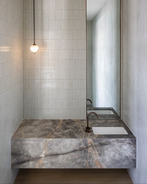 Marble magic in the powder room: our unique #FiorDiBosco marble steals the show in this sleek bathroom design. The floating vanity creates a sense of lightness, while the textured wall adds a subtle contrast that lets the marble shine. A true statement of luxury meets simplicity! • Book your inspection today in Melbourne or Sydney to discover the allure of natural stone: 📧 melbourne@fumaustralia.com.au 📧 sydney@fumaustralia.com.au Sleek Bathroom Design, Sleek Bathroom, Floating Vanity, Grey Background, The Blocks, The Marble, Textured Wall, Gray Background, Powder Room