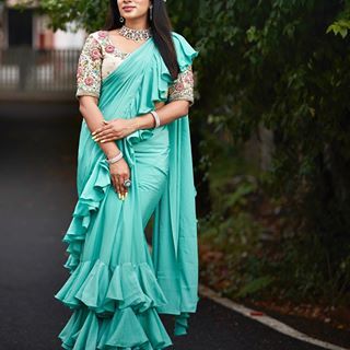 Beautifully crafted Bridal blouse in pink and teal green combination 😍 . . #pleatz #preethifazel #frenchknots #scallop #cutwork #goldzari… Satin Ruffle Saree, Half Saree Models, Fitted Blue Saree With Ruffles, Ready To Wear Ruffle Saree, Elegant Semi-stitched Ruffled Saree, Green Ruffle Saree, Green Combination, Saree Style, Ruffle Saree