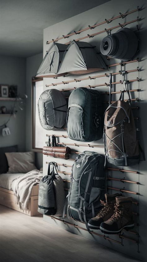 A minimalist room with a clean and simple camping gear wall, featuring organized outdoor gear and accessories. Camping Gear Wall, Minimalist Camping Gear, Outdoor Gear Organization, Outdoor Gear Storage, Camping Gear Organization, Gear Organization, Minimalist Camping, Gear Wall, Garage Storage Inspiration