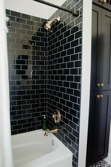 Black Tiled Bathroom Wall, Black Bathtub Shower Combo, Black Shower Tile With Tub, Black Subway Tile Shower Bathroom, Black Tile Shower Tub Combo, Black Vertical Subway Tile Bathroom, Bathroom Black Tile Wall, Black Subway Tile Bathroom Wall, Black Tile White Tub