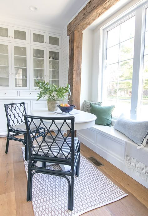 White breakfast nook with rustic beams and green pillows Kitchen Bumpout, Druid House, Casa Rock, Rustic Beams, Eating Nook, Breakfast Nook Table, Nook Table, Window Benches, Home Coffee Tables