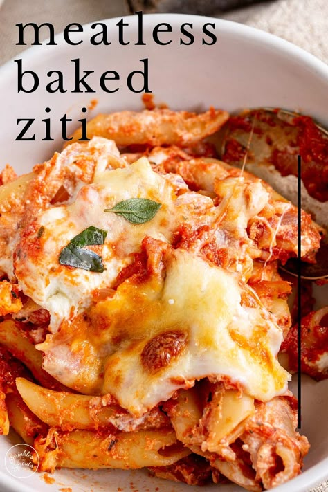 This Meatless Baked Ziti is a delicious warming dish perfect for a comforting dinner to share with loved ones. This fantastic pasta bake is the vegetarian version of a classic baked ziti. It is easy to make and is loaded with flavor, thanks to an easy-to-make rich tomato sauce and three kinds of cheese - ricotta for creaminess, mozzarella for those all-important string cheese pulls, and parmesan for some sharp, salty cheese flavor. No Meat Baked Ziti, Baked Mostaccioli Recipe Easy, Baked Ziti Vegetarian, Meatless Baked Ziti, Baked Mostaccioli Recipe, Classic Baked Ziti, Vegetarian Alfredo, Baked Mostaccioli, Baked Ziti With Ricotta