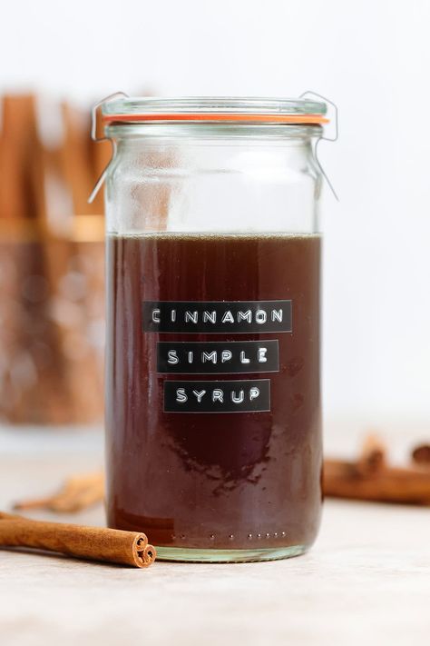 This Cinnamon Simple Syrup takes less than 30 minutes to make and calls for only 4 ingredients! It's such a delicious homemade syrup and it has a ton of uses! You can use this syrup in coffee, lattes, cocktails, mocktails, or you can even drizzle it over pancakes! It's totally fool-proof and freezer-friendly! Cinnamon Simple Syrup Recipe, Cinnamon Syrup For Coffee, Cinnamon Syrup Recipe, Thyme Simple Syrup, Homemade Coffee Syrup, Orange Simple Syrup, Gingerbread Granola, Baked Apple Oatmeal, Cinnamon Simple Syrup