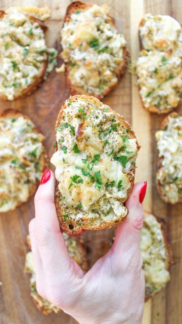 Alessandra DeNardo on Instagram: "You guys asked for holiday apps so I present to you: artichoke bruschetta. PERFECT to bring to any event, you can make in advance and then just warm up at your destination, or bake the entire thing there if you have an oven. This is lighter than a more traditional spinach / artichoke because it just uses ricotta (and not that much - feel free to add more…). I ate every single one of these in this video 😵‍💫 recipe below -for every 1 C of chopped artichokes, add 3/4 C of ricotta and 1/4 C of pecorino. If at the end your mixture seems too artichokey for you, add a spoonful more of ricotta. -to that same base amount, add the zest of 1/2 lemon, a generous pinch of salt, and black pepper -slice your bread - I used a semolina loaf, into 3/4 inch slices, and c Artichoke Bruschetta, Holiday Apps, Eat Veggies, Spinach Artichoke, Pinch Of Salt, Oven Roast, Artichoke, Black Pepper, Ricotta