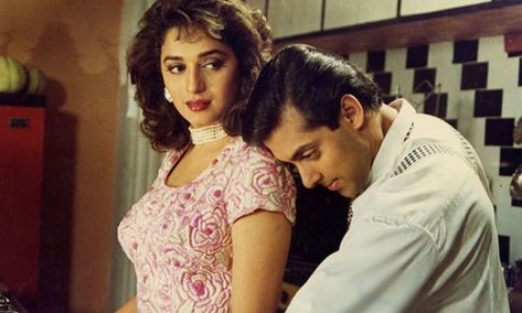 Hum Aapke Hain Koun is one of the greatest movies ever made in Bollywood. The big-budget film has everything, from extravaganza weddings, khatta-meetha bond between a devar-bhabhi, a big lawn where the family plays cricket, a cute puppy named Tuffy and a beautiful plot. The Madhuri Dixit and Salman Khan starrer film beautifully portrayed the idea of falling in love secretly, so much so that the whole nation felt the vibe.      After this, Madhuri and Salman’s chemistry was hailed in the Maduri Dixit, Hum Aapke Hain Koun, Vintage Bollywood Aesthetic, Salman Khan Photo, Romantic Photos Couples, 90s Bollywood, Bollywood Outfits, Bollywood Couples, Vintage Bollywood