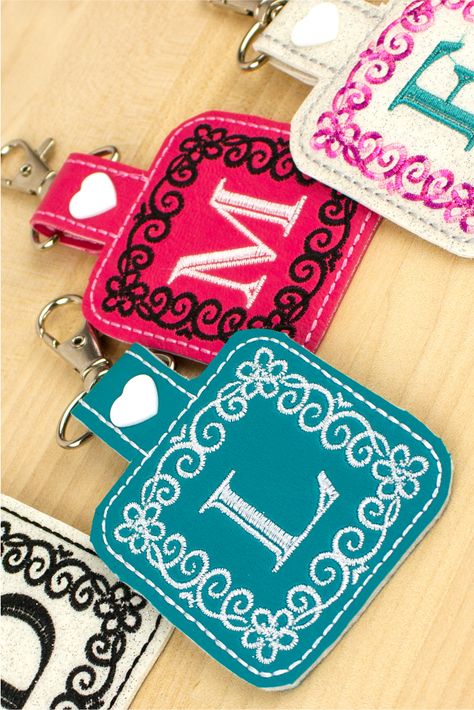 Learn how to make in-the-hoop key fobs with Designs by JuJu's Julie Trieb in our new FREE Webcast: Keepsake Key Fobs. Julie will also walk us through how to add her new Mary Kate Monogram design with or without software, how to embroider on vinyl fabric, and so much more! #DesignsByJuJu #SulkyThreads #sewbetterwithsulky #keyfobs #sewingproject Ith Embroidery Designs Free, Embroidered Keychains Diy, Sew Keychain Key Fobs, Embroidery Patches Diy, Keychain Embroidery Design, Making Patches, Diy Key Fob, Embroidered Keychains, Embroidered Things