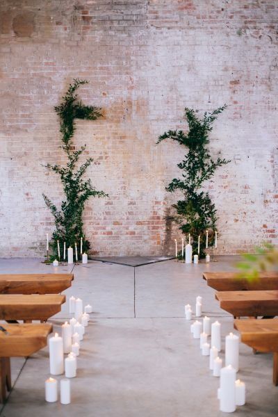 Industrial wedding ceremony decor idea - industrial warehouse wedding venue with brick wall decorated with candles and greenery vines {Anna Perevertaylo Photography} Diy Wedding Greenery, Industrial Wedding Ceremony, Industrial Wedding Decor, Blush Wedding Decor, Ceremony Arrangement, Rustic Wedding Decorations, Warehouse Wedding, Industrial Warehouse, Wedding Ceremony Backdrop