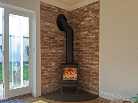 Gas Stove Fireplace Brick, Wood Burner In Corner Of Room, Adding A Wood Stove To Living Room, Brick Slip Fireplace Ideas, Brick Around Wood Stove, Brick Fireplace Wood Stove, Wood Stove Slate Surround, Tiles Behind Stove Wood Burning, Woodburner Hearth Ideas