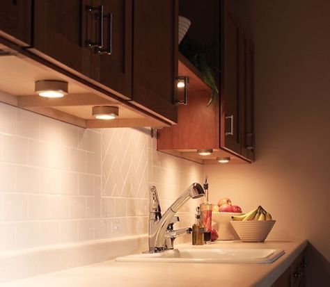 Title: Portable Under Cabinet lighting Def: These lights underneath the cabinet are used for task lighting. They can be moved and replaced easily in different spots under cabinets.