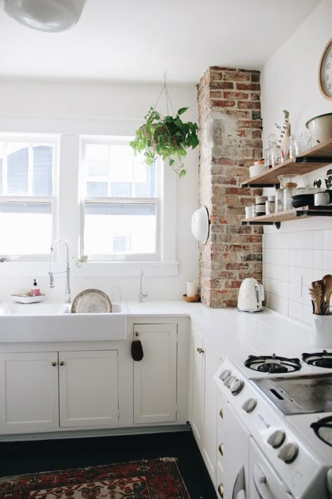 Inside the Nashville Home of an Airbnb Instagram Star Brick Chimney In Kitchen Exposed, Exposed Brick Pillar, White Kitchen Exposed Brick, Kitchen With Exposed Brick Chimney, Brick Column In Kitchen, White Wash Chimney, Brick Pillar Kitchen, Brick And White Kitchen, Brick Corner Wall