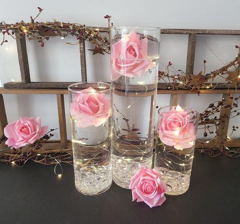 "If you are looking for the perfect gift or just want to add a touch of class to your decor, these Glass Cylinder Vases Centerpieces are the perfect choice. Absolutely great for wedding centerpieces, housewarming gift, bridal showers, baby showers, birthdays, corporate events, Christmas parties, Thanksgiving parties, contemporary home decoration, and outdoor-indoor party decor centerpieces, adding a romantic lovely atmosphere to your decoration. These beautiful individually hand blown centerpiec Pink Theme Centerpieces, 3 Cylinder Vase Centerpiece, Floating Centerpieces Wedding, Clear Vase Centerpiece, Cylinder Vase Centerpiece Wedding, Party Decor Centerpieces, Cylinder Vase Centerpiece, Pink Flower Centerpieces, Rose Centerpieces Wedding