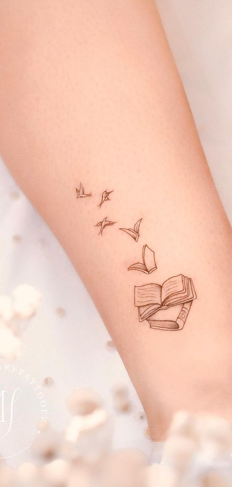 Beautiful book tattoos ideas for readers, tattoos for readers, meaningful tattoos, books tattoos, book tattoos tiny, book tattoos small, book tattoos sleeve, patchwork tattoos ideas, stack of books tattoos, book tattoos ideas simple, fine line art tattoo, book tattoos ideas small, meaningful literary tattoos for book lovers, book tattoos for literature lovers. Cute Small Book Tattoos, Tattoo For Writers Small, Literary Quotes Tattoos, Book To Bird Tattoo, Verity Tattoo Designs, Small Reader Tattoo, Bird Book Tattoo, Cute Book Tattoos For Women, Heart Book Tattoo