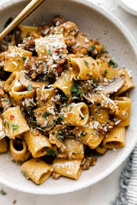 This Creamy Marsala Pasta is classic Italian comfort food at its finest! Spicy Italian sausage & deeply caramelized mushrooms tossed into your pasta of choice with the best creamy marsala sauce. The secret ingredient? – a handful of toasted walnuts, which add surprising, satisfying meaty texture. This easy pasta recipe has the perfect balance of spicy-subtly sweet-savory flavor despite taking less than 35 minutes to throw together. An all-time favorite! #marsalapasta #marsalasauce #pastarecipes Sausage Italian Recipes, Italian Sausage Mushroom Pasta, Restaurant Lunch Specials, Mushroom Sausage Pasta, Spicy Italian Sausage Recipes, Spicy Italian Sausage Pasta, Sausage Mushroom Pasta, Hot Italian Sausage Recipes, Meaty Pasta