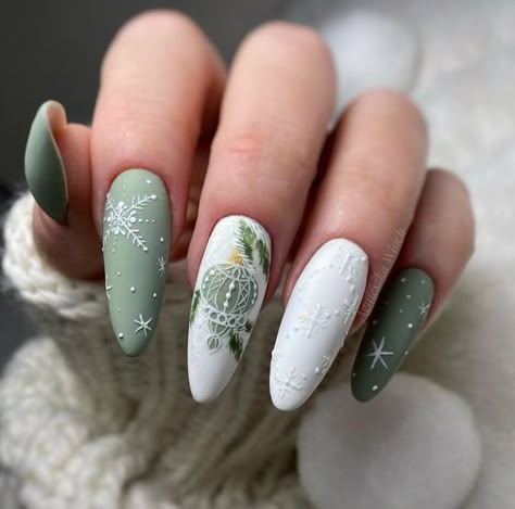 White and sage green nail colors in matte finish with Christmas-themed nail arts on long almond nails Christmas Gel Nails, Almond Nails Designs, Christmas Nails Acrylic, New Year's Nails, Xmas Nails, Christmas Nail Designs, Christmas Nail Art, Fancy Nails, Nail Polishes