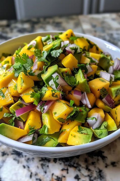 A refreshing and healthy salad with a combination of sweet mangoes and creamy avocados. Mango And Avocado Salad, Avocado Mango Salad, Mango And Avocado, Sesame Beef, Rocket Salad, Grilled Prawns, Sweet Potato Gnocchi, Mango Avocado, Avocado Salad Recipes