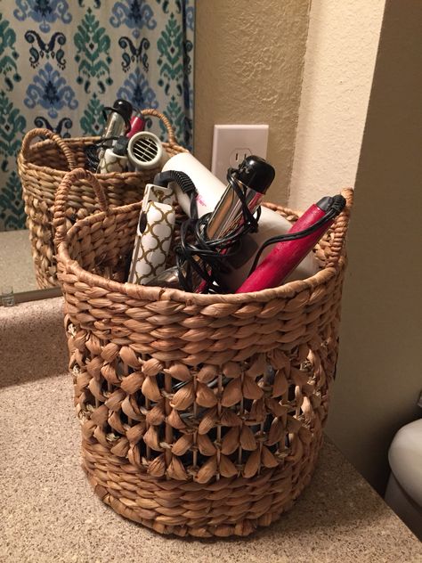 Small wicker basket to organize hair dryer, straighteners and curling irons. #organization Storage Hair Products, Bathroom Organization Under Sink Hair Tools, Organize Hair Styling Tools, Organize Hair Dryer And Curling Iron, Hair Utensil Storage, Hair Things Organization, Makeup Basket Storage, Hair Brushes Organization, Organize Hair Brushes