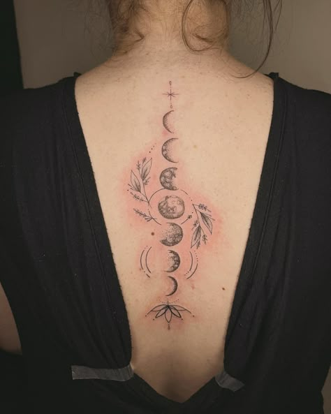 Discover the beauty of moon tattoos and their historical significance. Learn about different moon phases and styles, as well as cultural influences and popular designs. Care for your moon tattoo with expert tips. Tattoo Moon Phases Back, Back Tattoo Women Moon Phases, Moon Phases Tattoo Acotar, Moon Phase With Flowers Tattoo, Moon Phases Tattoo Designs Spine, Back Tattoo Moon Phases, Back Moon Tattoo Women, Tattoo Ideas Moon Phases, Spine Tattoos For Women Moon Phases