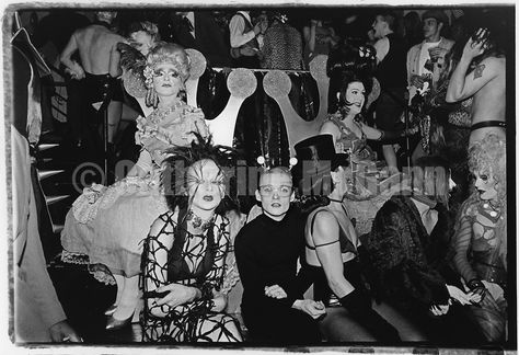 Winter 1994:  Seated:  Billy Beyond (center, with glasses), Joey Arias (top hat) and friends at the Club Kid King and Queen of New York contest at Limelight nightclub in New York City, WInter, 1994 Limelight Nightclub, Party Monster Movie, New York 1990s, Mudd Club, Joey Arias, New York City Winter, Party Monsters, Michael Alig, Leigh Bowery