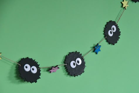 These Studio Ghibli inspired Soot Spirits decoration is made out of MDF wood and the eyes are made of acrylic. It's all made out of leftover materials and therefore it's sustainable. This is a nice addition for every Ghibli lover to decorate your room with or use at decoration for a themed party. The sling will always have 6 Soots and 7 star shapes. It's ±1 meter long. Because it's made out of MDF I would suggest to make sure it won't get wet, because that material doesn't go well with water. Th Studio Ghibli Themed Birthday Party, Studio Ghibli Car Decor, Studio Ghibli Bedroom Decor, Studio Ghibli Door Decs, Ghibli Home Decor, Studio Ghibli Classroom, Studio Ghibli Baby Room, Studio Ghibli Home Decor, Ghibli Themed Room