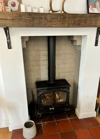 'What I wish I had known before buying a log burner for my home' reveals an interior expert Adding A Wood Stove To Living Room, Dining Room With Wood Burning Stove, Gas Stove Living Room, Fireplace Vs Wood Stove, Wood Burning Stove Enclosure, Corner Wood Stove Mantel Ideas, Wood Burning Stove Cabin, Woodburner Surround Ideas, Wood Burning Stoves Living Room Ideas