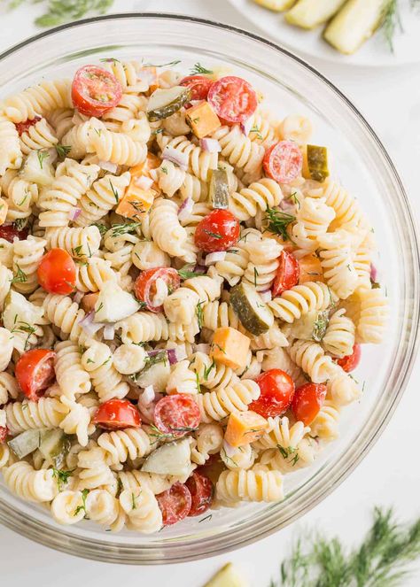 This creamy, briny, and tangy dill pickle pasta salad comes together quickly and can be made the day it's served or, better still, chilled overnight. It's the perfect side dish! Pickle Pasta Salad Recipe, Pickle Pasta Salad, Pickle Pasta, Dill Pickle Pasta Salad, Dill Pickle, Pasta Salad Recipes, Perfect Side Dish, Salad Dressing, Simple Ingredient