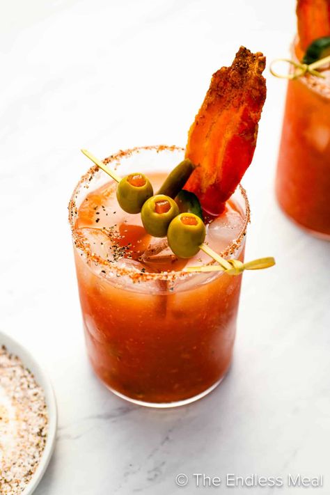 PIN TO SAVE FOR LATER! A Bloody Caesar is a classic Canadian cocktail. It is similar to a Bloody Mary but has a lot more depth of flavor. We make our own homemade Clamato juice (it's easy!) for the best flavor. Want to know how to make the best Caesar drink? We'll show you how! #theendlessmeal #bloodycaesar #bloodymary #caesar #ceasar #caesarcocktail #caesardrink #caesarrecipe #bloodymaryrecipe #clamato #homemadeclamato #clamatojuice #brunch #brunchcocktails #brunchdrinks #breakfast #cocktails Caesar Drink, Caesar Cocktail, Caesar Recipe, Breakfast Cocktails, Pork Sliders, Brunch Drinks, Sunday Dinners, Southern Fried Chicken, Brunch Cocktails