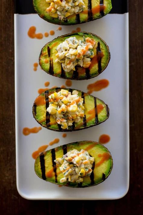 MEXICAN STREET CORN IN GRILLED AVOCADO BOATS Vegan Barbeque Recipes, Grill Avocado, Vegan Mexican Street Corn, Healthy Barbecue Recipes, Vegan Barbeque, Vegan Barbecue Recipes, Supper Meals, Avocado Boats, Vegan Bbq Recipes